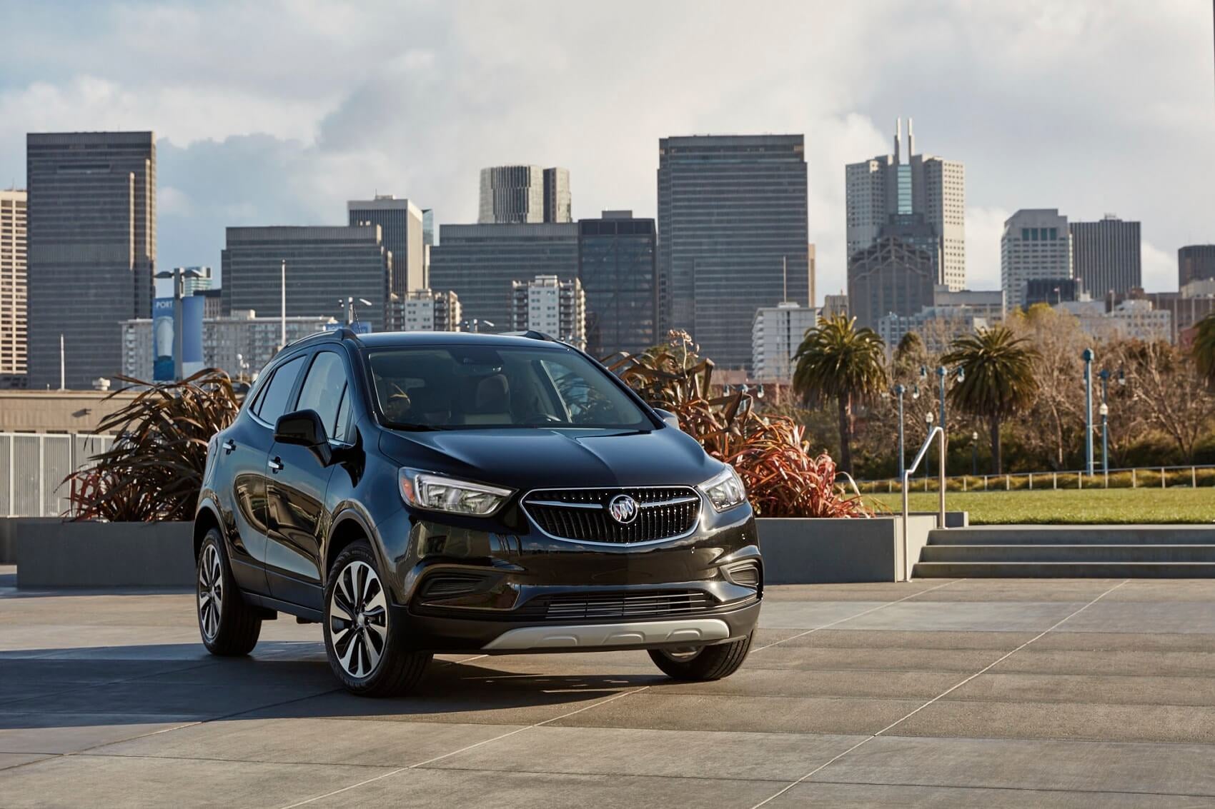 Black Buick Encore GX in Front of City